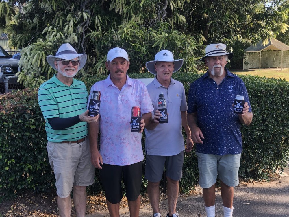 4 smiling golfers holding their drinks that are staying nice and cool in their Cheers, Big Ears Bilby Stubby Coolers.
